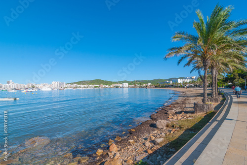 Ibiza sunshine on the waterfront in Sant Antoni de Portmany, Take a walk along the main boardwalk, now a stone concourse beside the beach. 