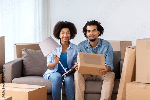 happy couple with stuff moving to new home