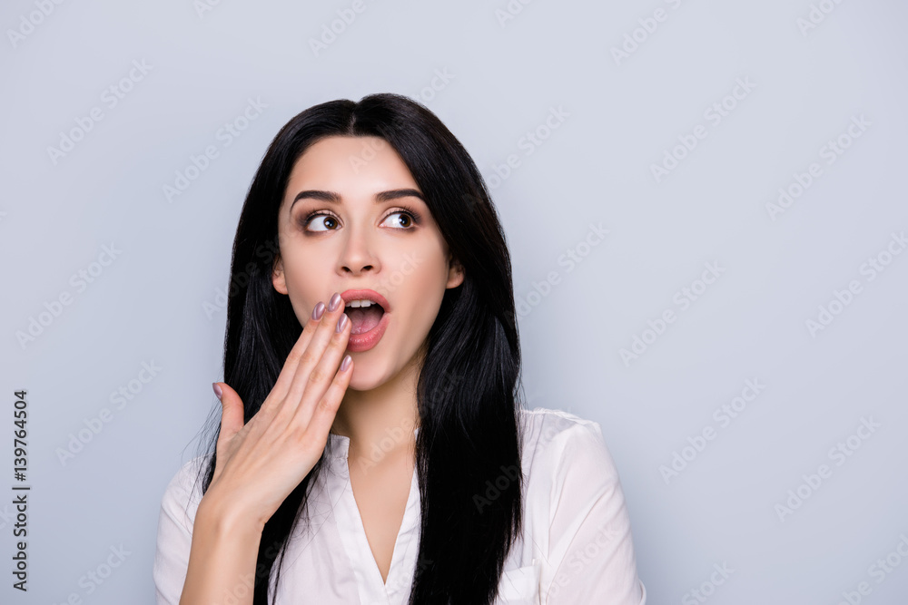 Close up portrait of beautiful cheerful excited young woman with surprise open mouth and touch face Close up portrait of beautiful cheerful excited young woman with surprise open mouth and touch face