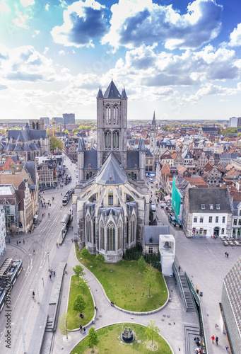 GENT, BELGIUM - MARCH 2015: Tourists visit ancient medieval city. Gent attracts more than 1 million people annually