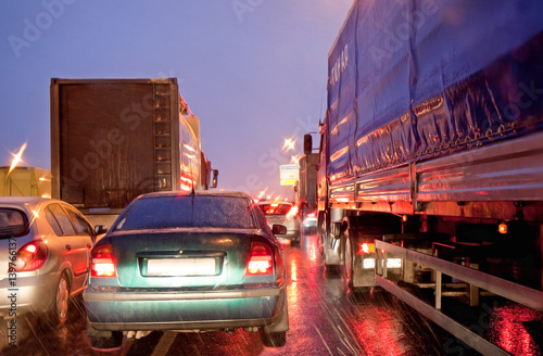 The movement of vehicles on the ring road at night. Ring road near Moscow photo