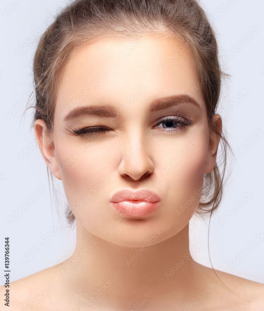 Portrait of pretty girl ,winking at camera Portrait of pretty girl ,winking at camera