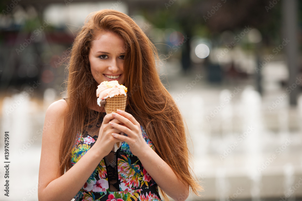 Young woman with ice cream in city on hot late summer afternoon Young woman with ice cream in city on hot late summer afternoon
