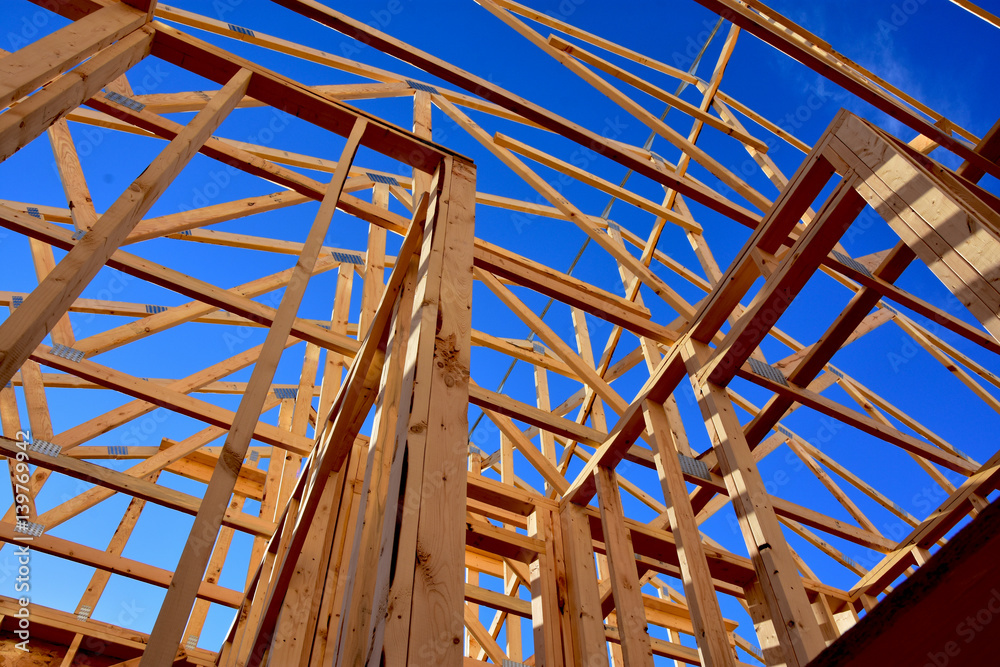 Wood frame residential structure under construction.