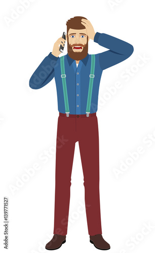 Hipster talking on the mobile phone and grabbed his head
