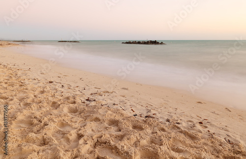 The Beach after Sunset at Fort Zachary Taylor Historic State Park, better known as Fort Taylor.  Key West, Florida. Photo shows the slow motion of water. photo