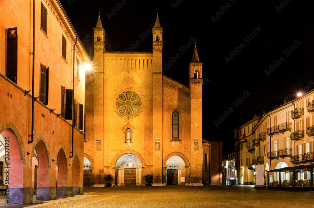 Piazza Risorgimento, main square of Alba (Piedmont, Italy) at night, with the facade of Saint Lawrence Cathedral