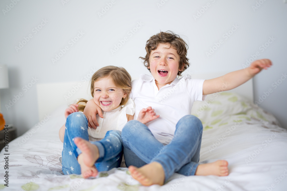 Brother And Sister Relaxing Together In Bed Brother And Sister Relaxing Together In Bed