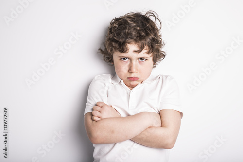 Papier peint Head and Shoulders Close Up Portrait of Young boy with Sulk attitude