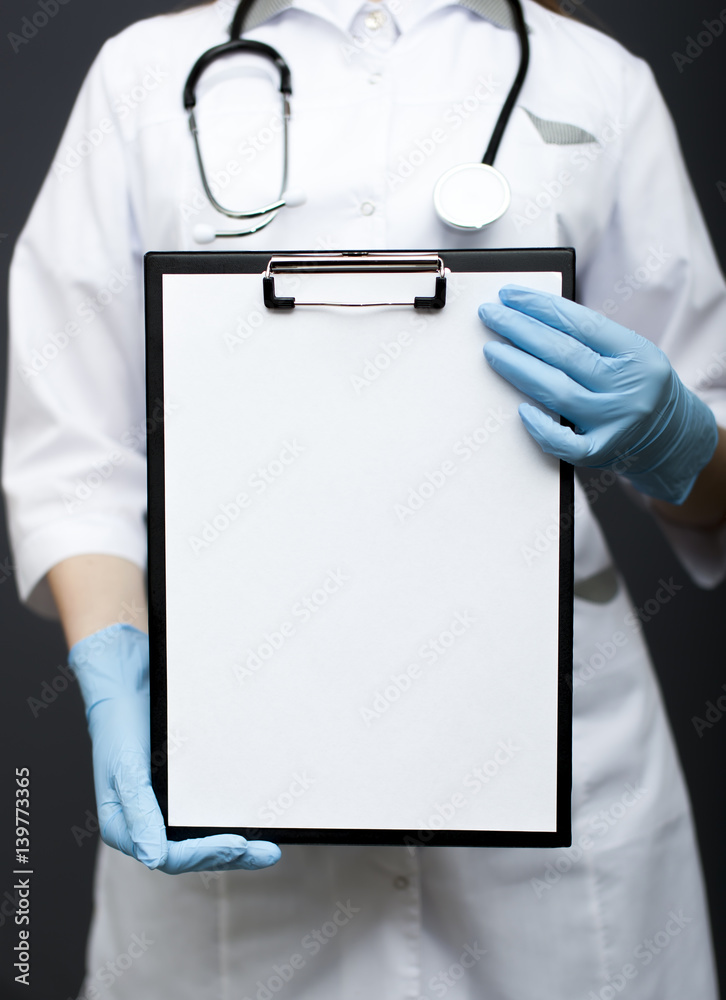 Woman doctor, nurse with  paper tablet. Place for text, cropped image