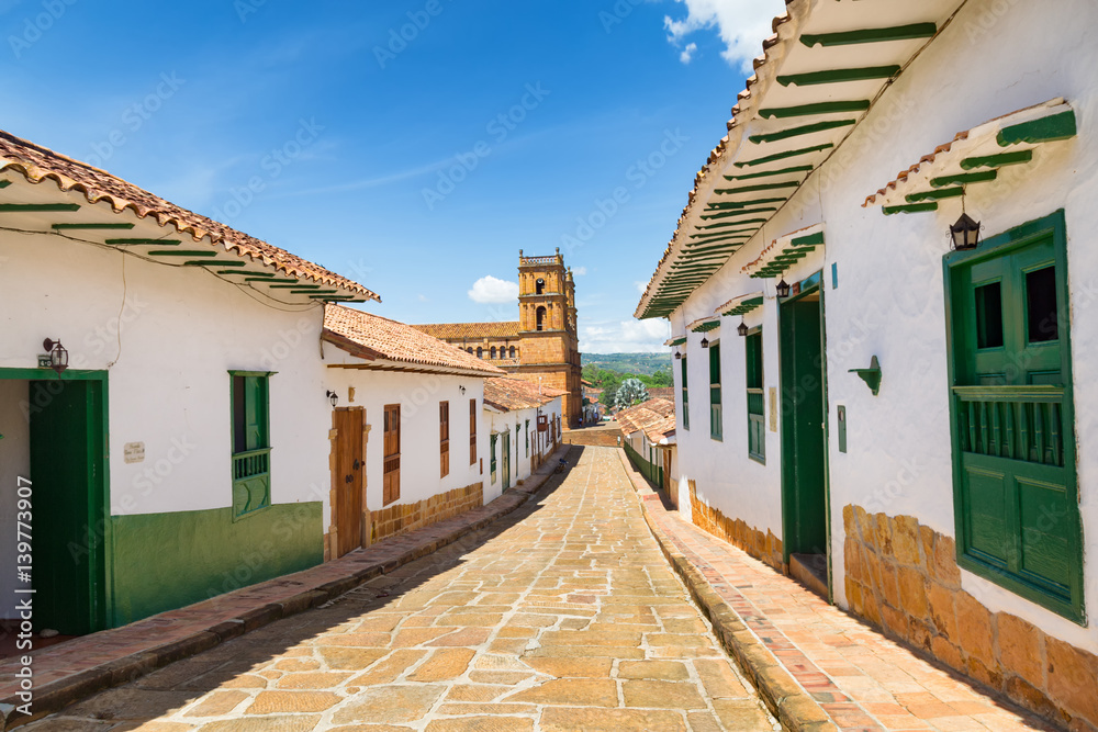 A cobblestone road leads down to the Cathedral of Barichara in Barichara, Colombia.