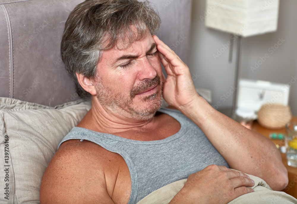 Obraz premium Sick man in bed