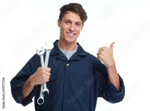 Car mechanic with wrench photo