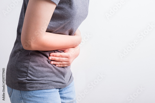 asian woman having stomachache