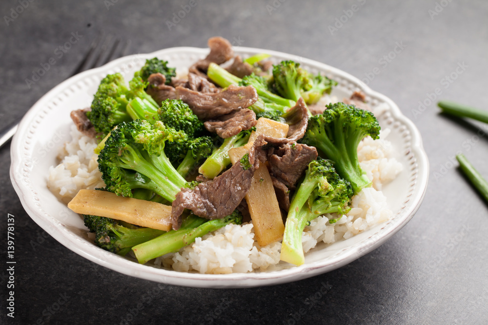 Beef N’ Broccoli Stir Fry on charcoal background with green beans to angled shot Beef N’ Broccoli Stir Fry on charcoal background with green beans to angled shot