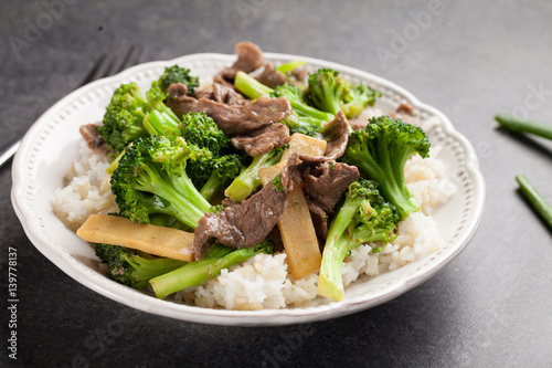 Beef N’ Broccoli Stir Fry on charcoal background with green beans to angled shot