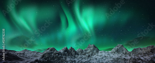 Aurora borealis above snowy islands © Aomarch