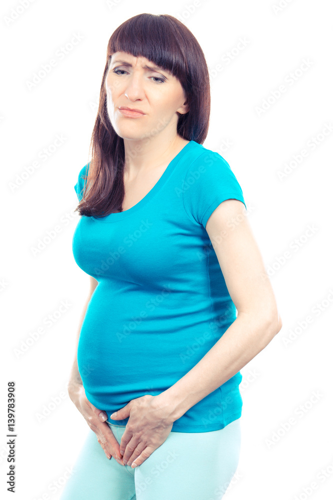 Sad pregnant woman with hands on her stomach, pregnancy health care and bladder aches Sad pregnant woman with hands on her stomach, pregnancy health care and bladder aches