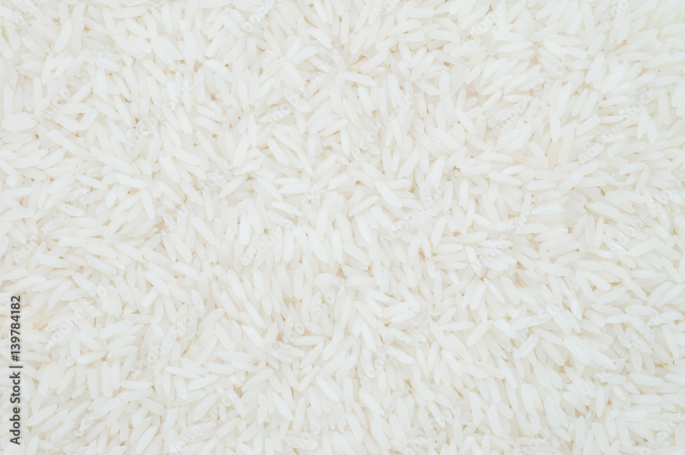 Closeup pile of white rice called jasmine rice textured background Closeup pile of white rice called jasmine rice textured background