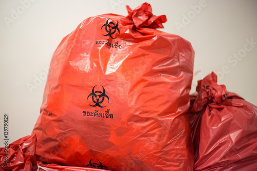 biological waste, red biohazard garbage bag