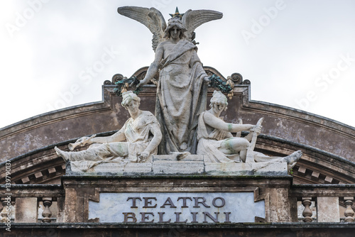 Statue on the roof of Teatro Massimo Bellini opera house in Catania city, Sicily Island, Italy