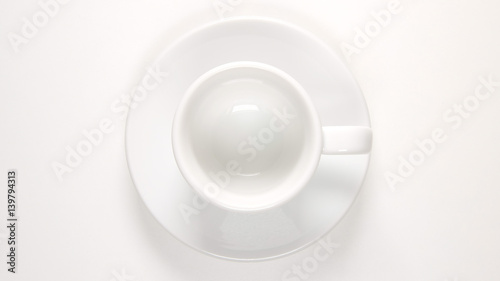 TOP VIEW: Empty white coffee cup on a white table