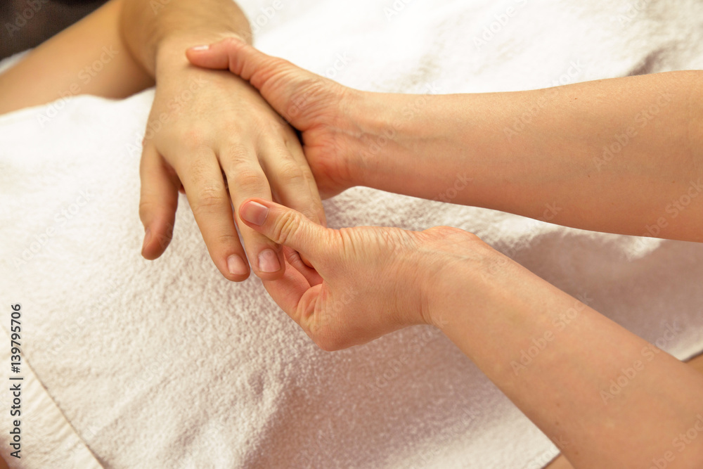 Hand massage with white towel, spa salon Hand massage with white towel, spa salon
