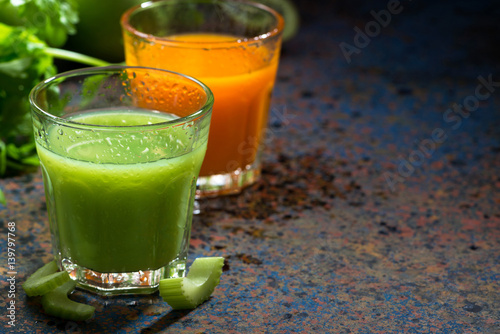 glasses of fresh juice from celery and carrots, closeup