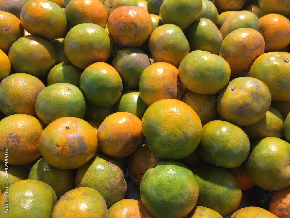 heap of Chinese orange stacked up. Lot of orange on sale in supermarket. Orange pattern for texture and background. heap of Chinese orange stacked up. Lot of orange on sale in supermarket. Orange pattern for texture and background.