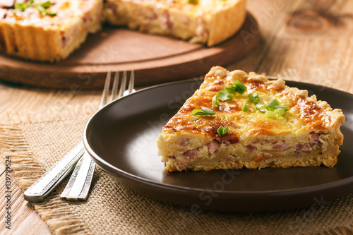 Traditional french pie with bacon and cheese - quiche lorraine. photo