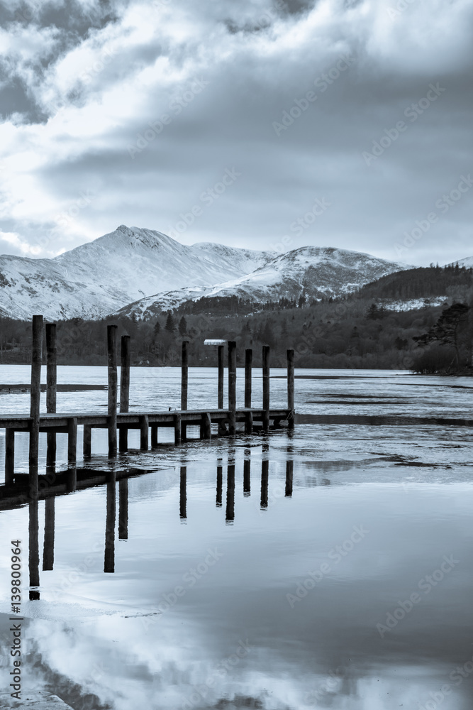 A pier juts out into the icy waters of Lake Derwent in the English Lake District