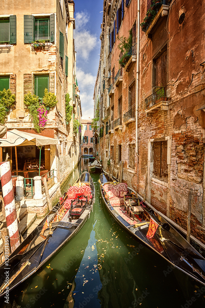two gondolas moored at Venice's canal. Italy