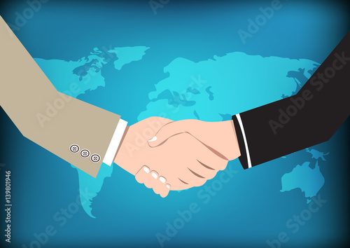 Business concept handshake on world map background