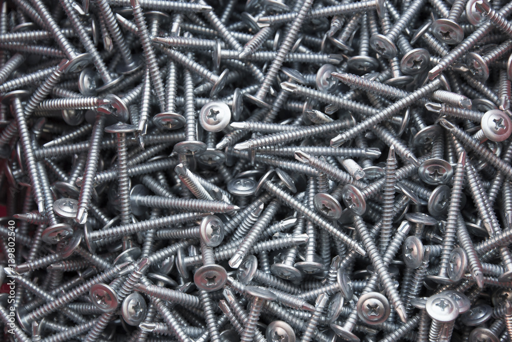 Background of metal silvery screws Background of metal silvery screws