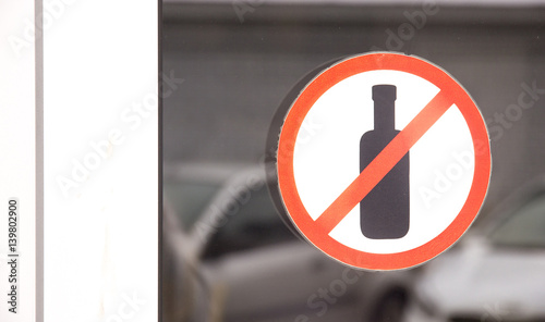 Sign Do not drink pasted on glass