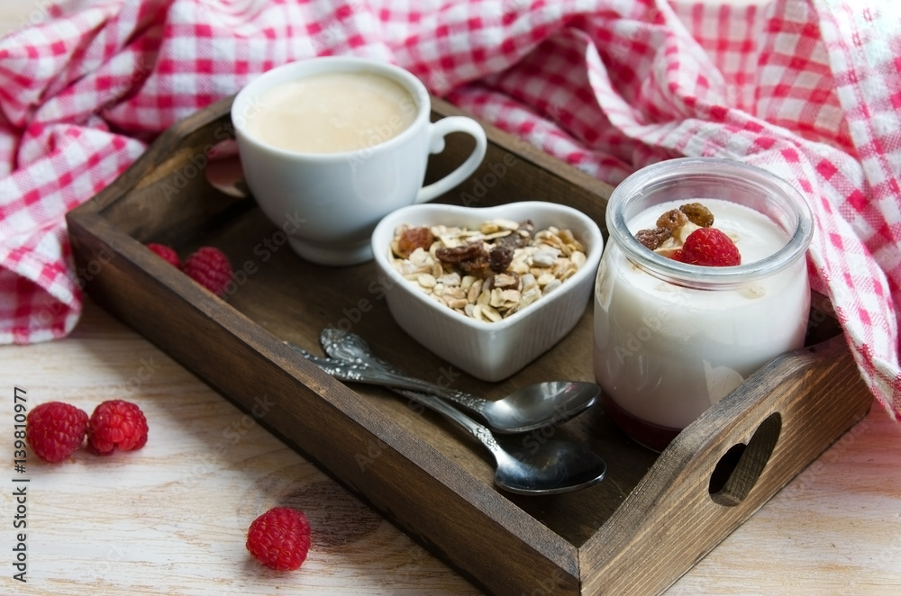 Fruit on the bottom yogurt jars, muesli and coffee on wooden tray with red check napkin. Yoghurt with raspberry jam and cappuccino. Concept for healthy eating or breakfast.
Fruit on the bottom yogurt jars, muesli and coffee on wooden tray with red check napkin. Yoghurt with raspberry jam and cappuccino. Concept for healthy eating or breakfast.