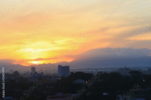 sunrise sky in the morning and silhouette building in city colorful nature. with copy space for add text
