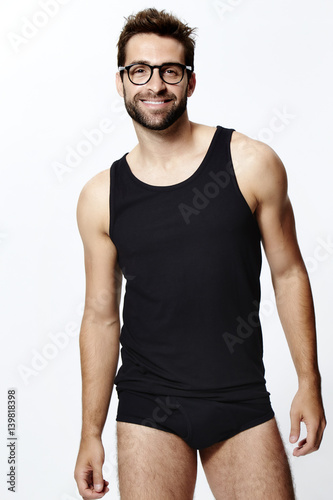 Man in glasses and underwear, smiling