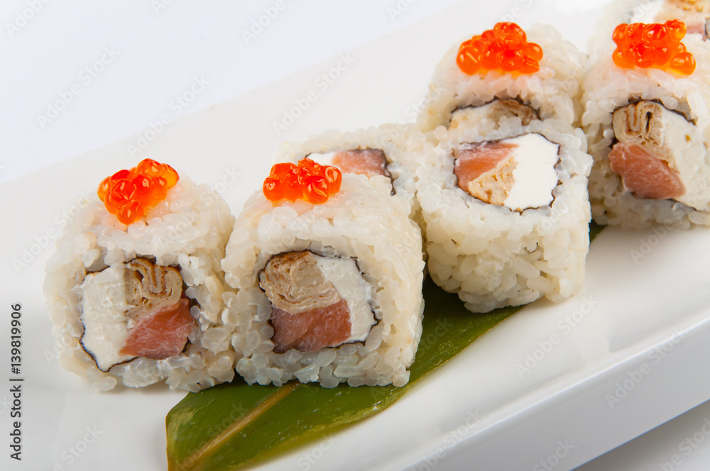 sushi roll with omelette and Philadelphia cheese with salmon and red caviar sushi roll with omelette and Philadelphia cheese with salmon and red caviar