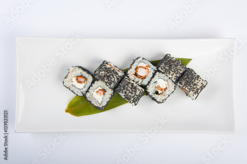 sushi roll with shrimp, Philadelphia cheese sesame seeds