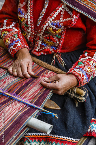 Quechua woman weaving traditional textile, Cuzco, Peru