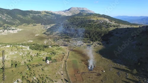 Bushes burning on Dinara mountain photo
