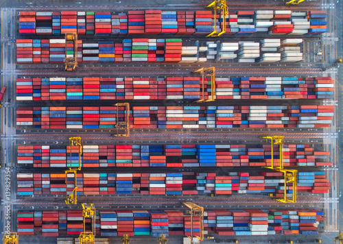 container ship in import export and business logistic.By crane ,Trade Port , Shipping.cargo to harbor.Aerial view.Water transport.International.Shell Marine.Top view.