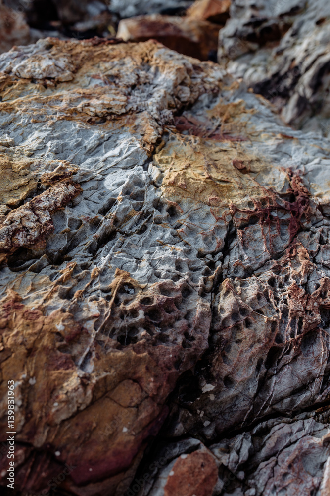 texture of a stone a close up of brown color with dark streaks texture of a stone a close up of brown color with dark streaks
