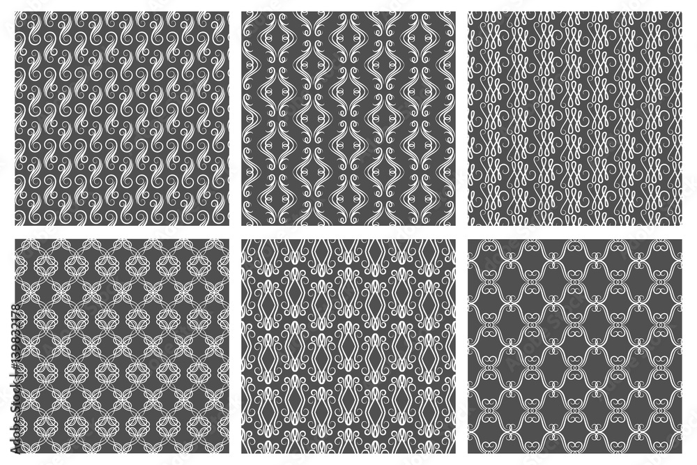 Ornamental white floral pattern set on gray backgrounds