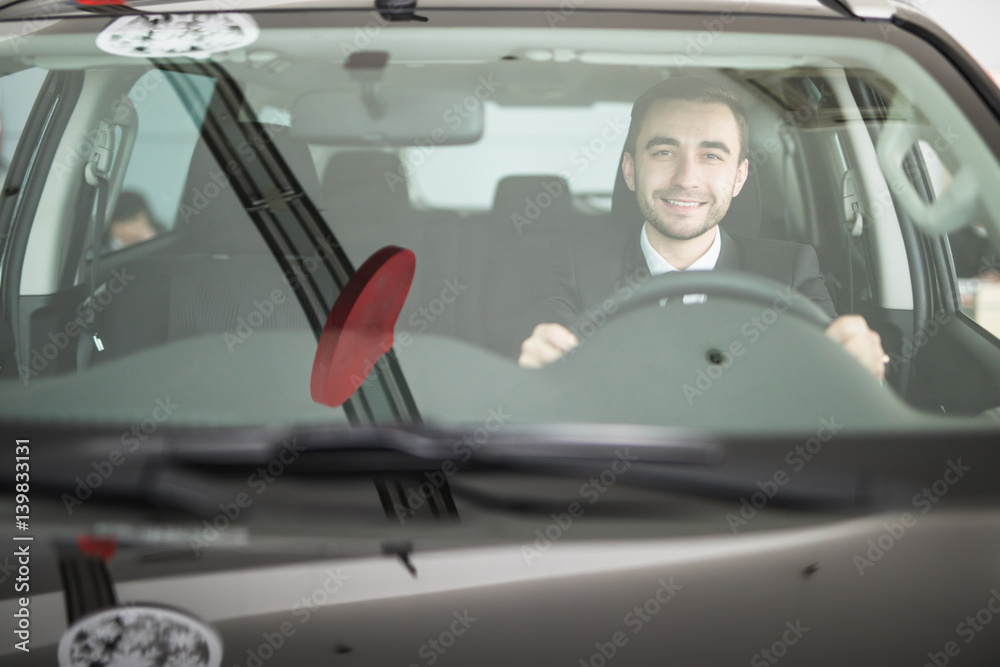 Obraz premium Handsome man driving his car