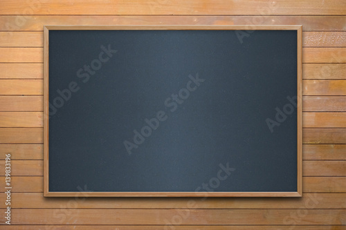 Empty room with chalkboard and white wood wall. Concept business, drawing, ideas, education.
