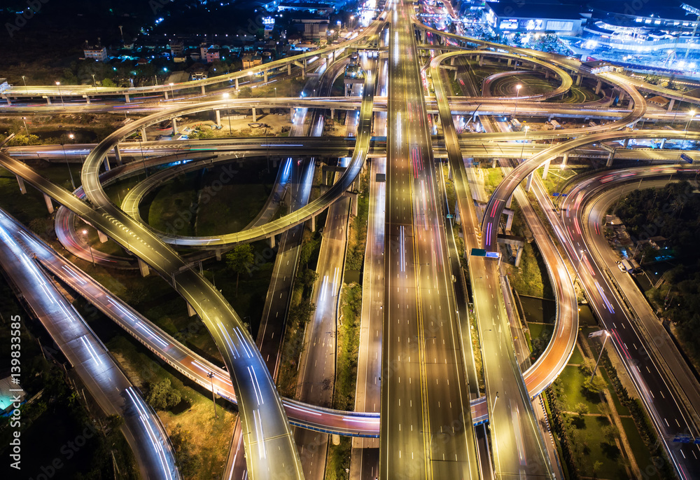 Aerial view Road roundabout. Expressway with car lots in the city in Thailand. Street large beautiful downtown. cityscape. Top view.Light the Night.