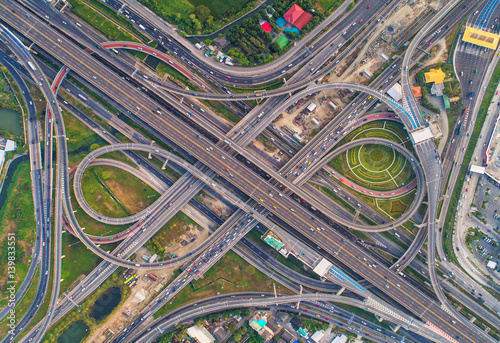 Aerial view Road roundabout. Expressway with car lots in the city in Thailand. Street large beautiful downtown. cityscape. Top view.