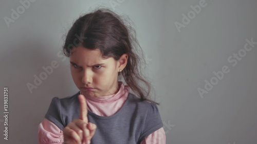 Teen girl shaking her head no finger gesture gesture is not denial, the emotion